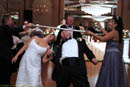 Bride and groom doing limbo